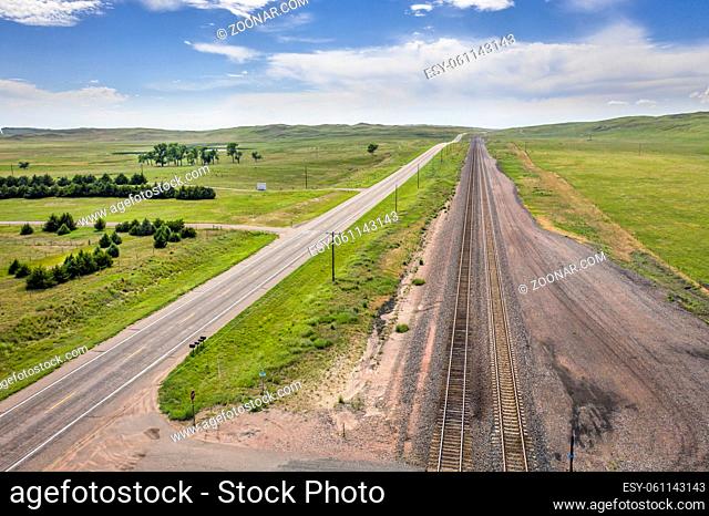 empty highway and railroad in Nebraska Sandhills, aerial view of summer scenery