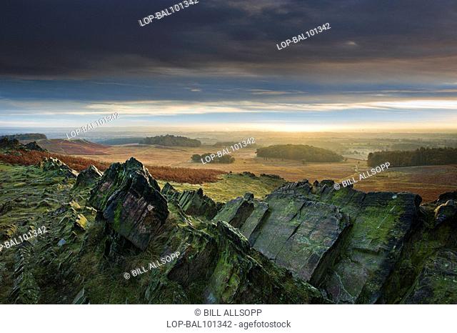 England, Leicestershire, Newton Linford. A view across craggy rocks toward Charnwood Forest
