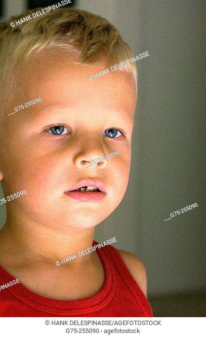 Portrait of young boy with dirty face