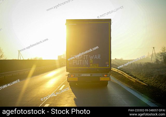 02 March 2022, Poland, Breslau: A truck with the inscription ""Stop it was Putin"" on its trailer drives across the A4 in Poland towards Wroclaw in the early...