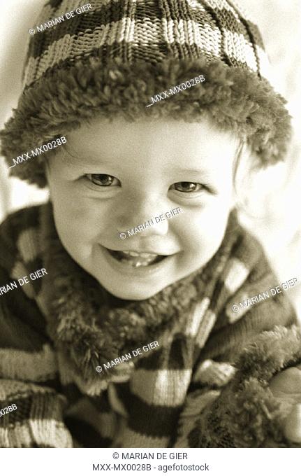 Toddler with touque smiling