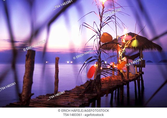 Colorfully illuminated bar with a small Pavilion at sea on Ko Chang