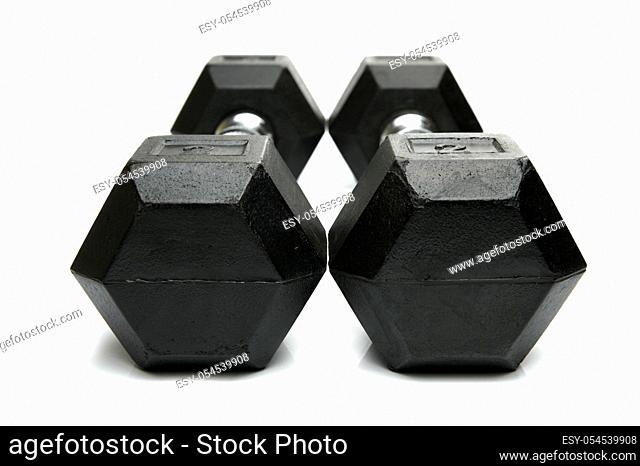 Weight lifting dumbbells isolated against a white background
