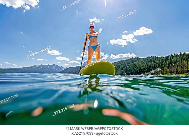touring on the Stand Up Paddle Board at Redfish Lake in the Sawtooth Mountains near the town of Stanely in central Idaho