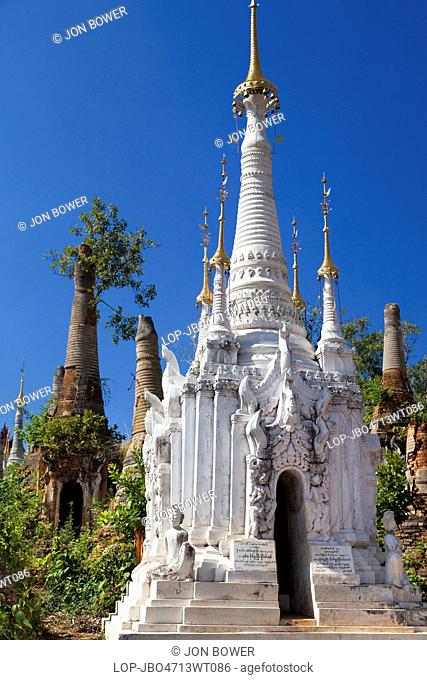 Myanmar, Shan, Shwe Inn Thein. The abandoned and overgrown pagodas of Inn Thein in Myanmar