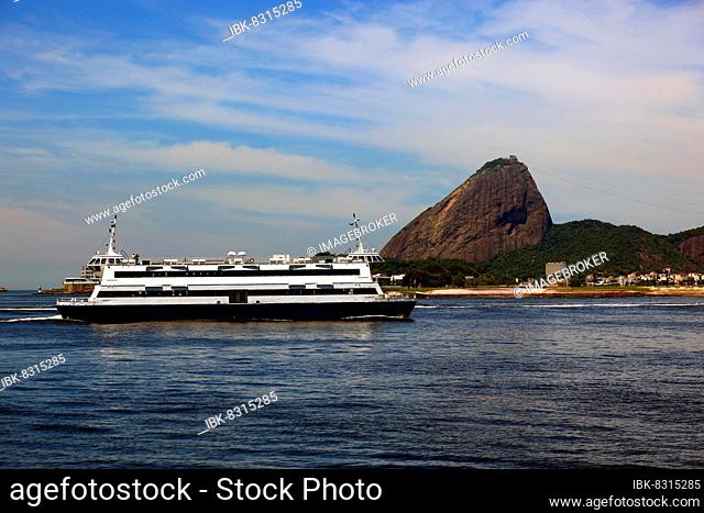 Cargo ship Double Pride in the Baia de Guanbara Bay in the east of Rio de Janeiro, Brazil. Sugar Loaf Mountain in the background