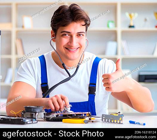 The computer repairman repairing desktop computer