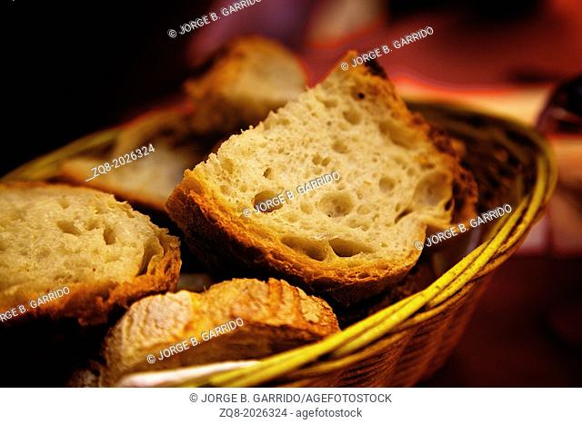 assortment of baked bread on wood table