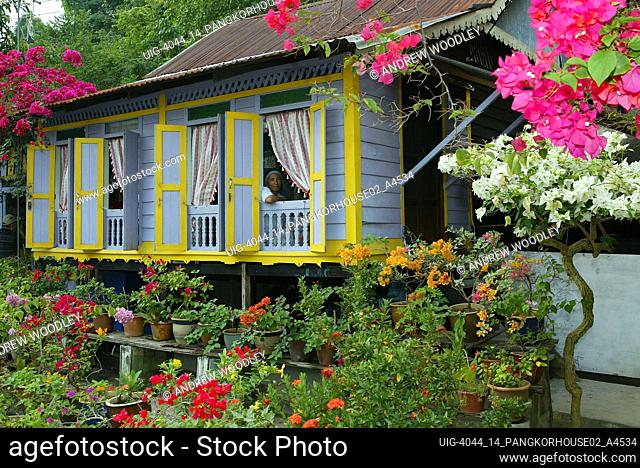Clapboard house on stilts with shutters Malay village Pulau Pangkor island Malaysia
