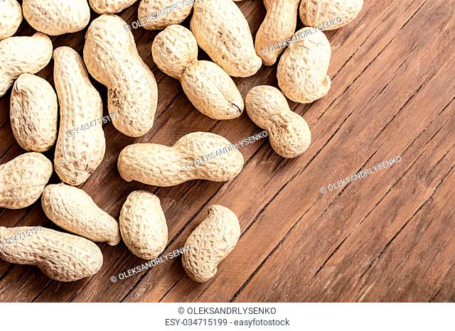 groundnut in the skin close-up on a wooden background