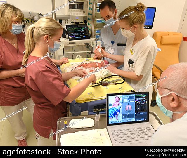 PRODUCTION - 17 March 2023, Saxony, Leipzig: On the neonatology ward of the University Hospital (UKL), pediatric nurse and specialist nurse for intensive care...