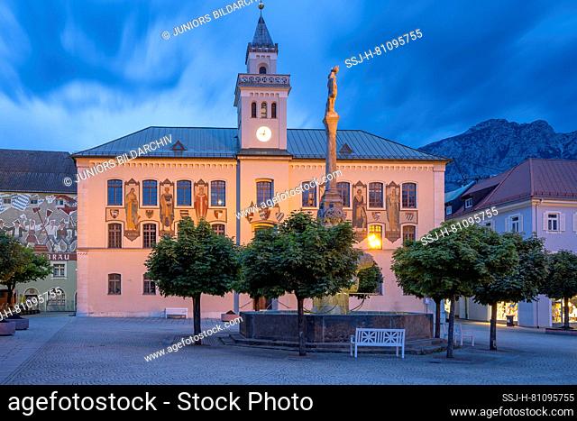 The blue hour at the old town hall in the pedestrian zone of the spa and shopping town Bad Reichenhall with the Wittelsbacher fountain, Berchtesgadener Land