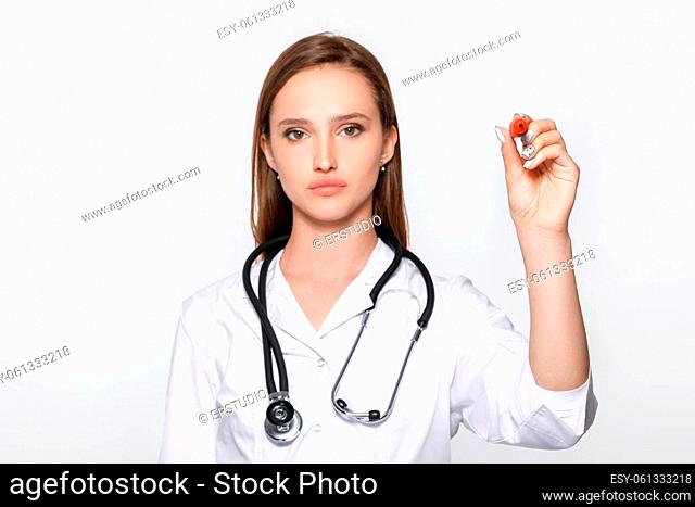 woman doctor hand with pen pointing on something. focus on hand