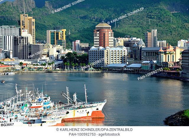26 January 2018, Mauritius, Port Louis: View across the water of the modern city center with office towers and Le Caudan Waterfront in Port Louis