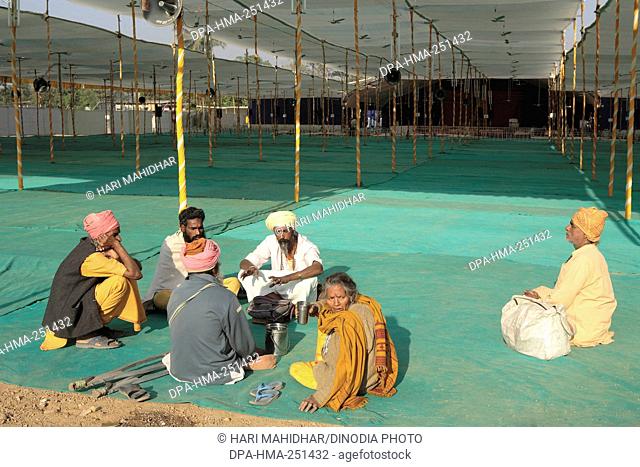 People sitting under pandal, mumbai, maharashtra, india, asia