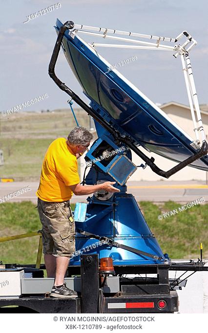 Storm chaser and Project Vortex 2 member Herb Stein repairs the Doppler on Wheels radar dish in Kimball, Nebraska, USA, May 21