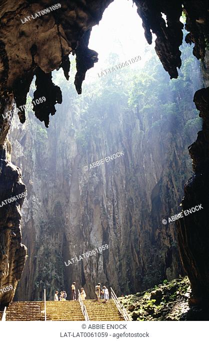 The Batu Caves are located on a limestone hill in the Gombak district, north of Kuala Lumpur, Malaysia which has a series of caves and cave temples