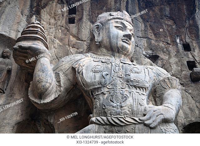 Carved statue, Fengxian Temple, Longmen Grottoes and Caves, Luoyang, Henan Province, China  Tang Dynasty