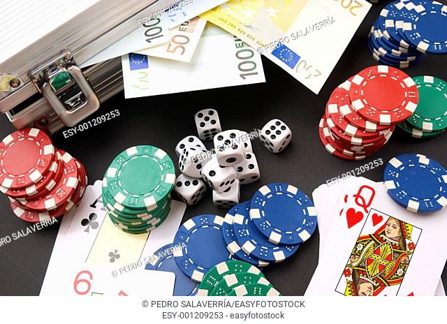 background gambling with euro banknotes, casino chips, cards and dices