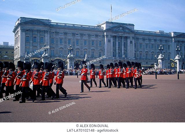 Buckingham Palace, royal residence. Daily Changing of the Guard parade. Soldiers in uniform. Crowd