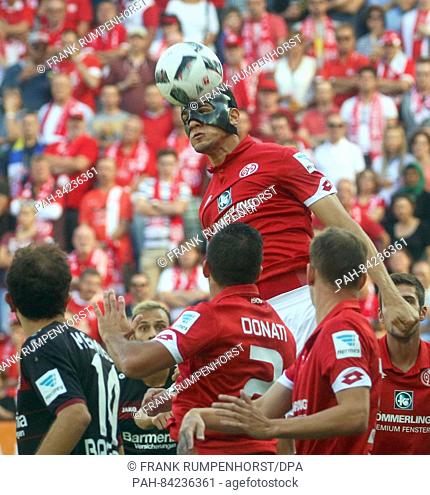 Mainz's Leon Balogun (top) in action during the Bundesliga soccer match between FSV Mainz 05 and Bayer Leverkusen at the Opel Arena in Mainz, Germany