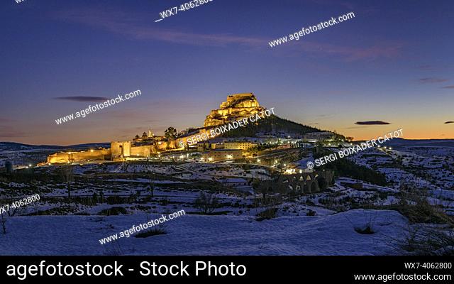 Morella medieval city in a winter twilight and night, after a snowfall (Castellón province, Valencian Community, Spain)