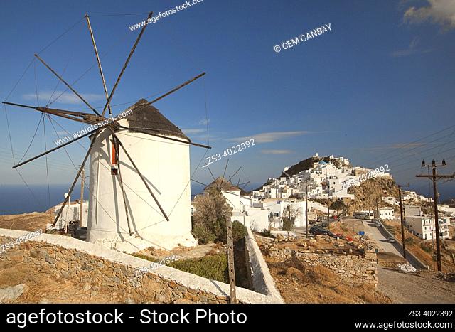 View to the whitewashed houses at the old town Chora-Hora with a traditional windmill in the foreground, Serifos Island, Cyclades Islands, Greek Islands, Greece