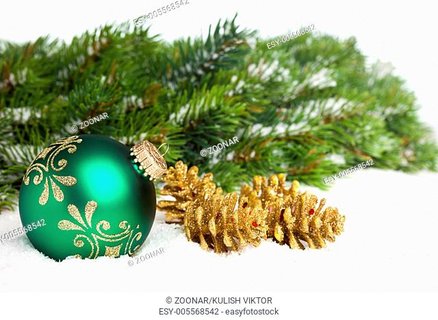 green ball with golden pinecone
