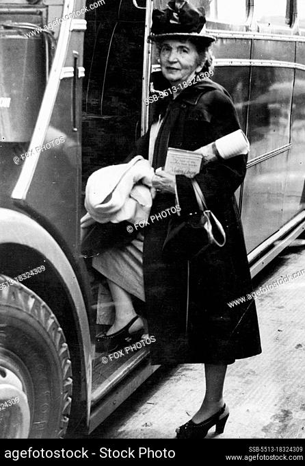 Advocate of 'San Babies"" Arrifes on England -- Mrs. Margaret Sanger Slee, bearding the Airport bus at Heathrow, London, on her arrival by air from the U