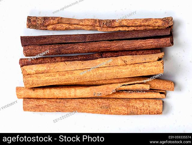 top view of cassia (chinese cinnamon) sticks close up on gray ceramic plate