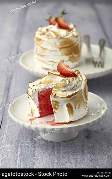 Iced meringue tarts with strawberry filling