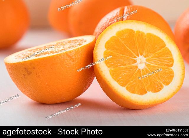 fresh ripe healthy cut oranges on table