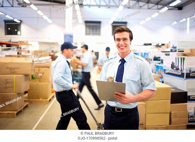 Worker standing near boxes in shipping area