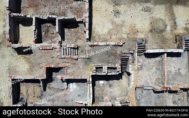 30 June 2022, Hamburg: View of the excavation area around the main church of St. Trinitatis in Altona. Numerous house ground plans from the 18th century have...