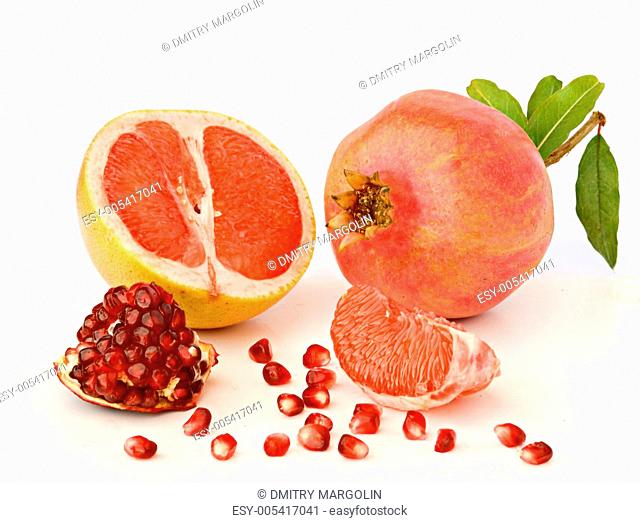 Pomegranate and grapefruit isolated on white background