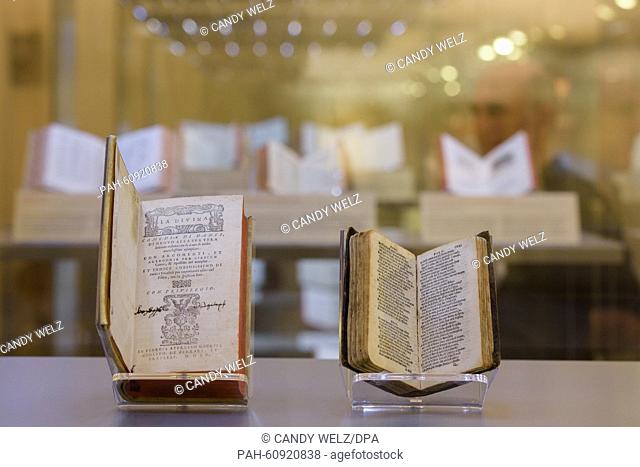 The first edition of the comedy 'Divina Commedia' from 1555 and a miniature edition of the work from 1516 (R) by Dante Alighieri (1265-1321) are seen at the...