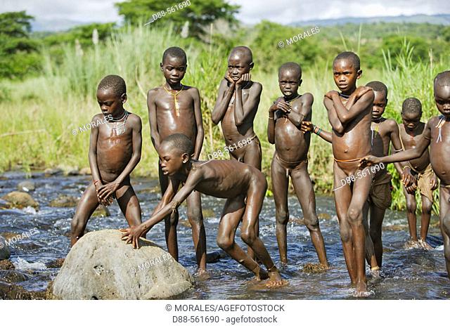 Surma children playing in the water of Kibisch river. Near Kibish. Ethiopia