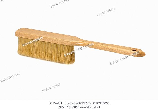 Bench brush with wooden handle isolated on white background. Dust brush or counter duster on white background
