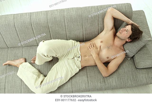 Young man resting on couch