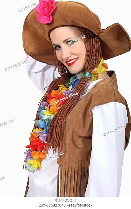 Woman wearing brown hat and wig with flowers around neck