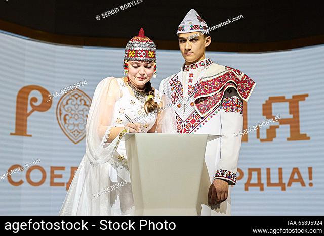 RUSSIA, MOSCOW - DECEMBER 1, 2023: Newly-weds Anastasia Mochalova and Maxim Gorsky are seen during a wedding ceremony according to traditions of the Republic of...