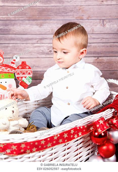 Portrait of 1 year old baby boy, Christmas theme, studio shot