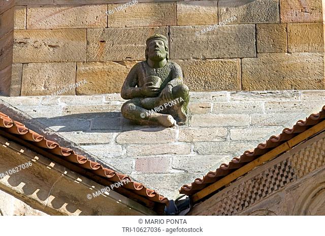 the man sitting on the slope of the roof - the church of saints Peter and Paul in Rosheim - Alsace - France