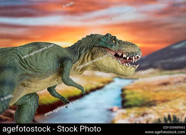 Tyrannosaurus rex in the foreground with cretaceous land in the background at sunrise