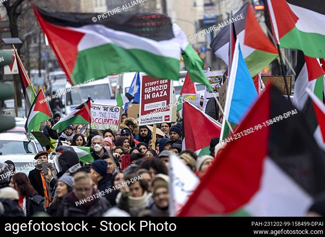 02 December 2023, North Rhine-Westphalia, Duesseldorf: Numerous people march through the city center at a pro-Palestine rally under the slogan ""Stop the...