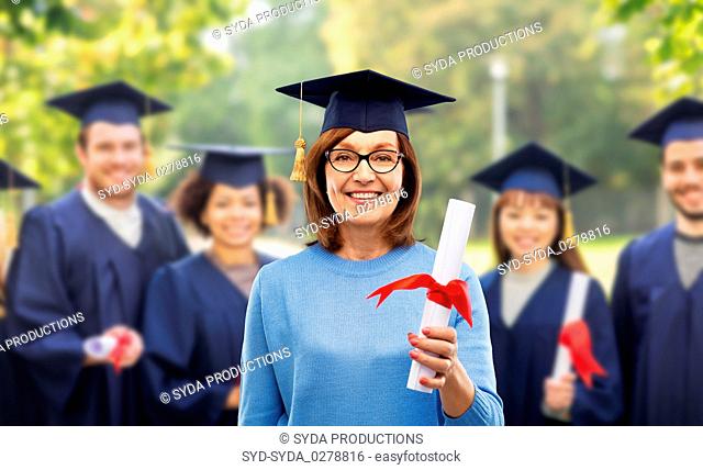 happy senior graduate student woman with diploma
