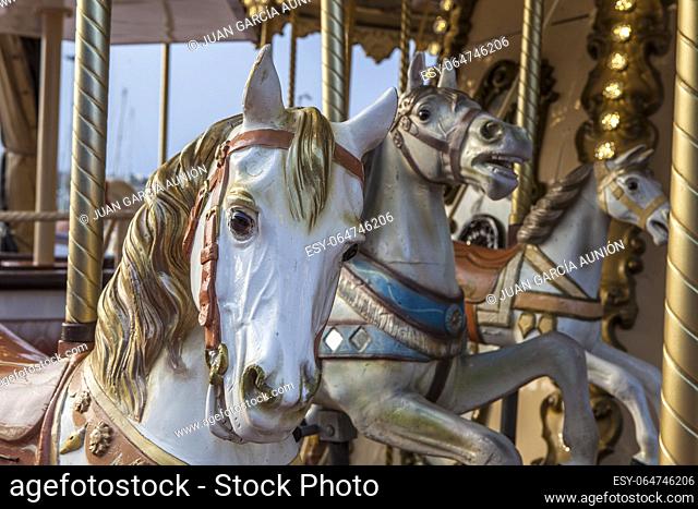 Vintage trendy merry-go-round or carousel. Horse head detail