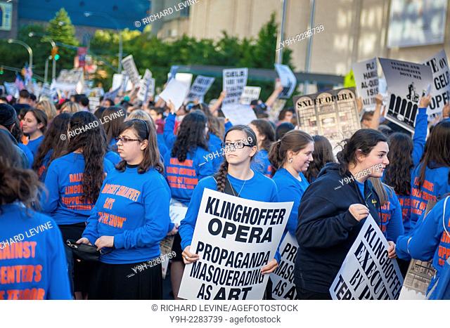 Girls from Yeshiva Breshet Shalhevet join hundreds of Jews and supporters to protest in front of the Metropolitan Opera at Lincoln Center on opening night