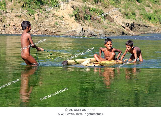 Children playing in the Sangu river in Thanchi in Bandarban, Bangladesh December 2, 2009