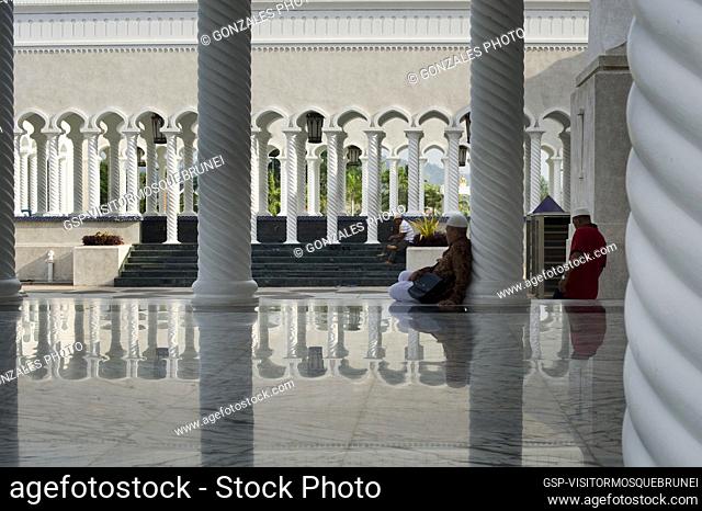 Visitors at the Sultan Omar Ali Saifuddien Mosque. The Mosque is located in Bandar Seri Begawan in the Sultanate of Brunei